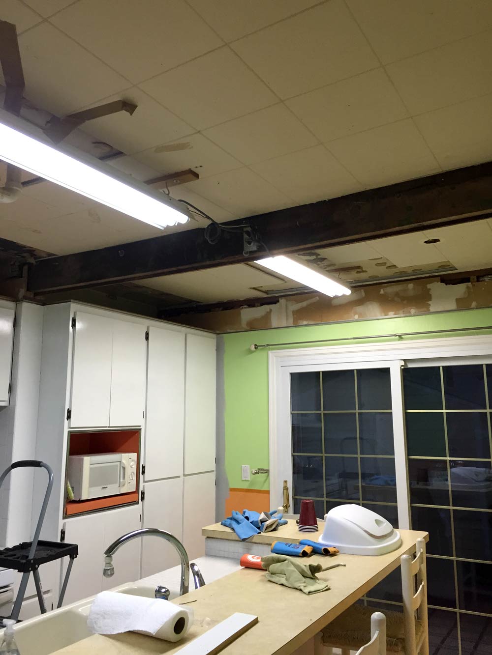 removing a kitchen drop ceiling metal edge and industrial beam
