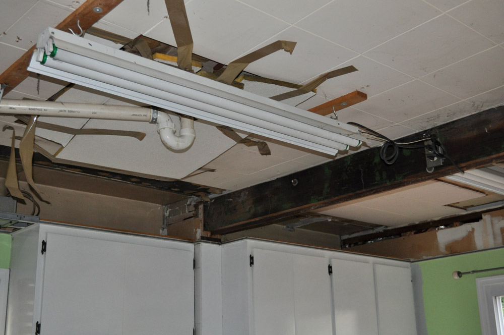 removing a kitchen drop ceiling hidden plumbing and lights
