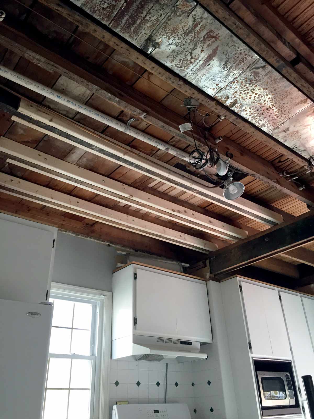 Sistering joists to support bathtub load over kitchen