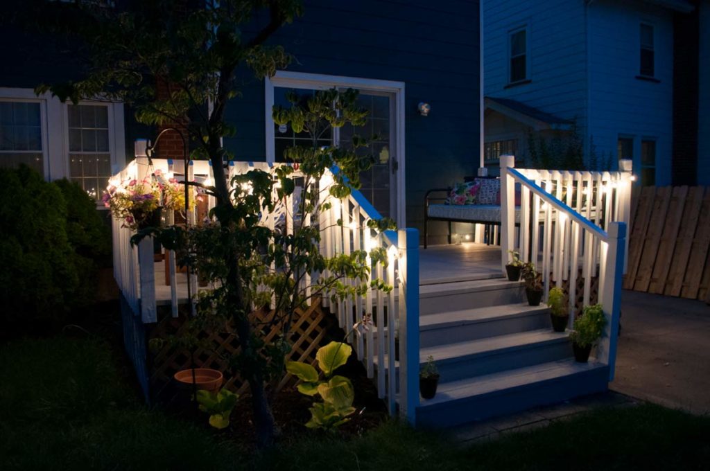 Back deck with string lights at night