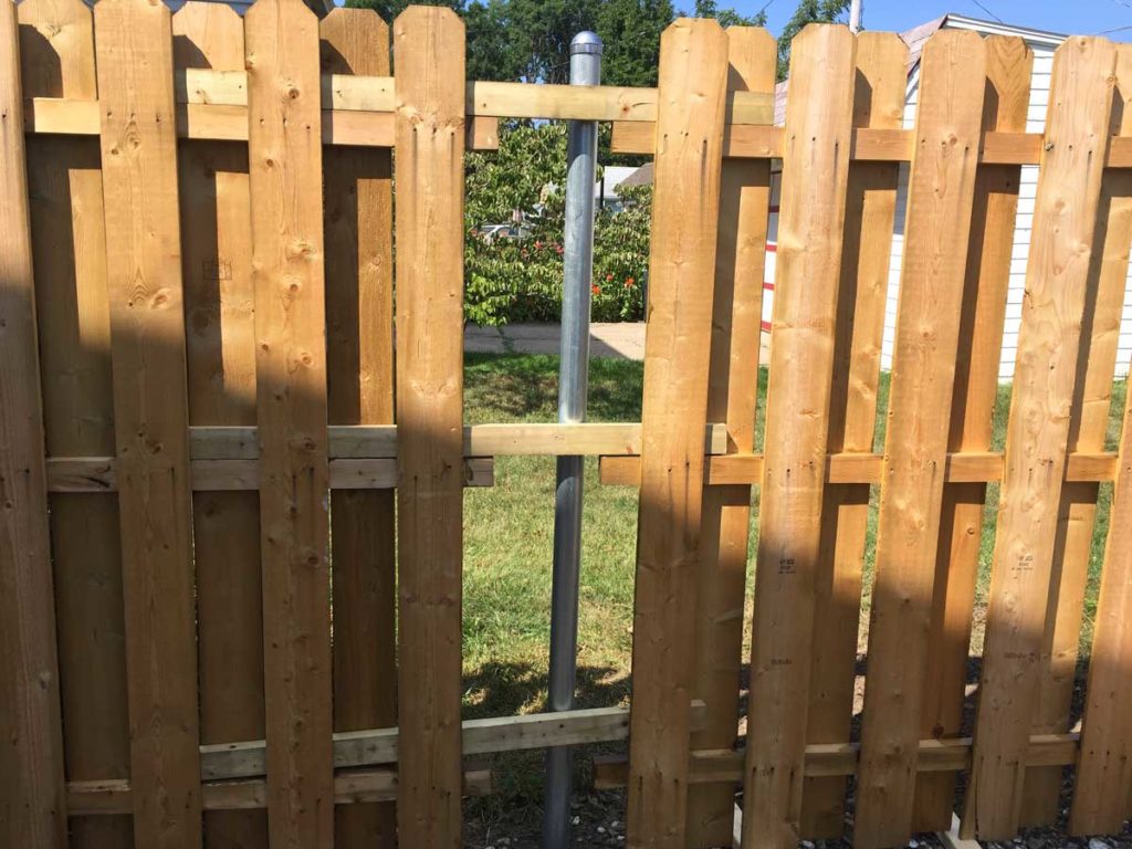 bridging the gap between two fence panels and converting a chainlink fence to a wood fence