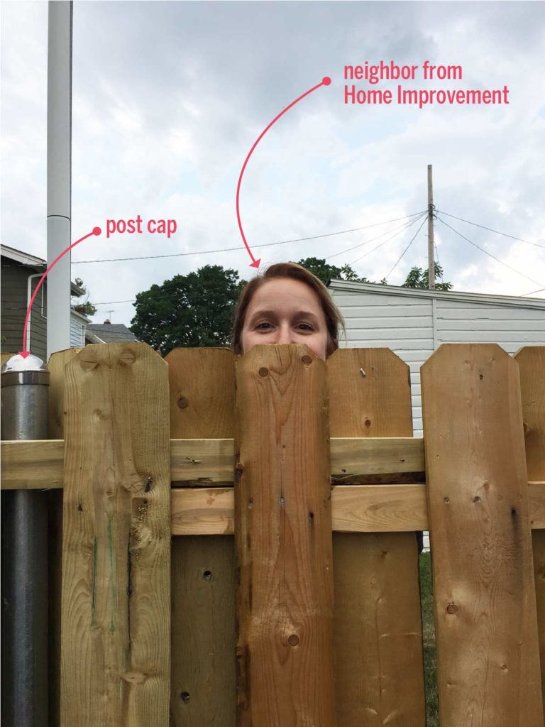 Use post caps on steel fence posts when converting a chainlink fence to a wood fence