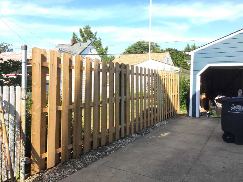 converting a four foot chainlink fence to a six foot wood fence