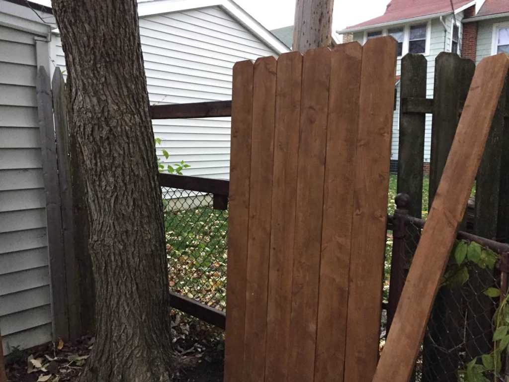 Attaching a wood fence to a chainlink fence And Then We Tried