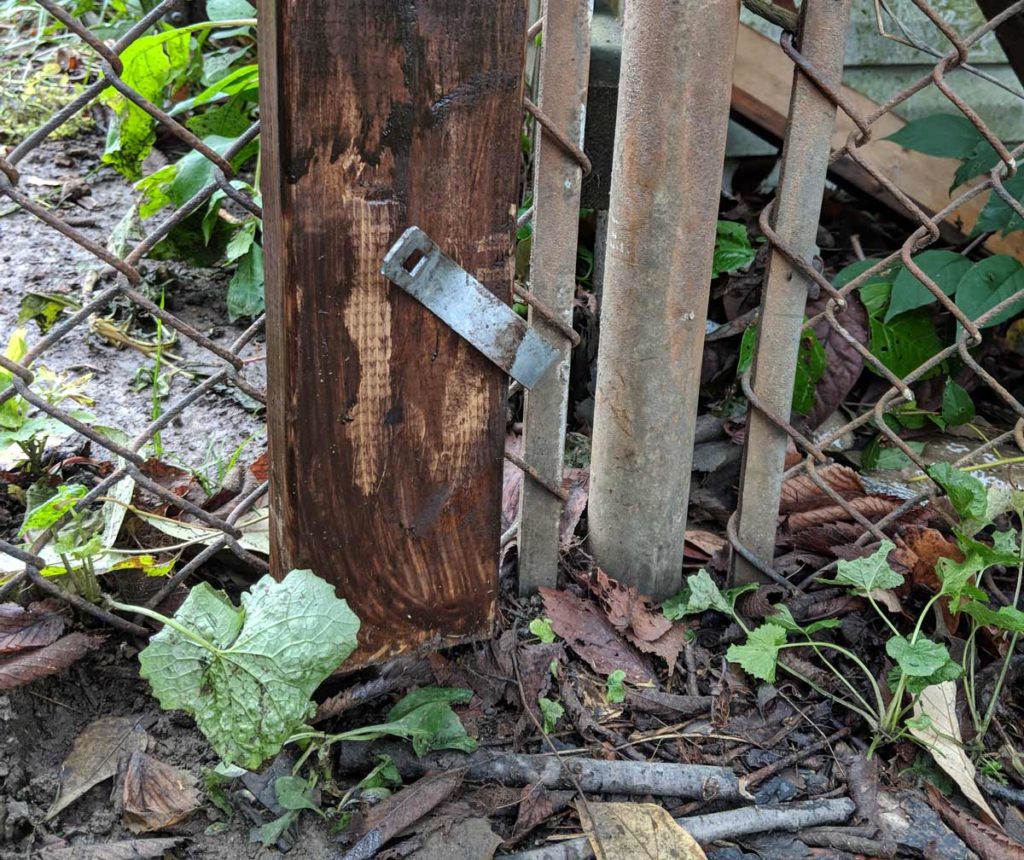 Attaching a wood fence to a chainlink fence And Then We Tried